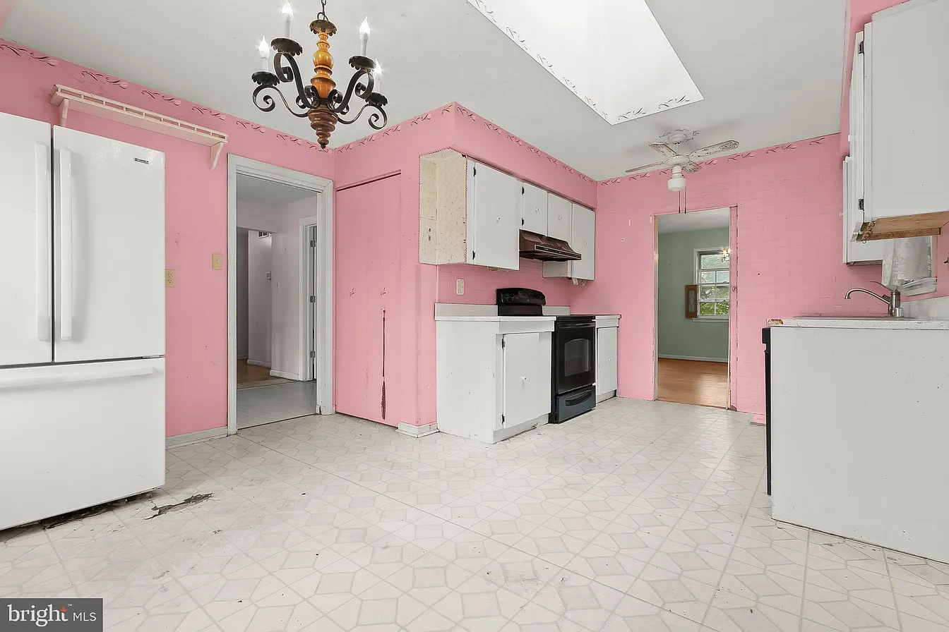 Dated pink kitchen — before renovation